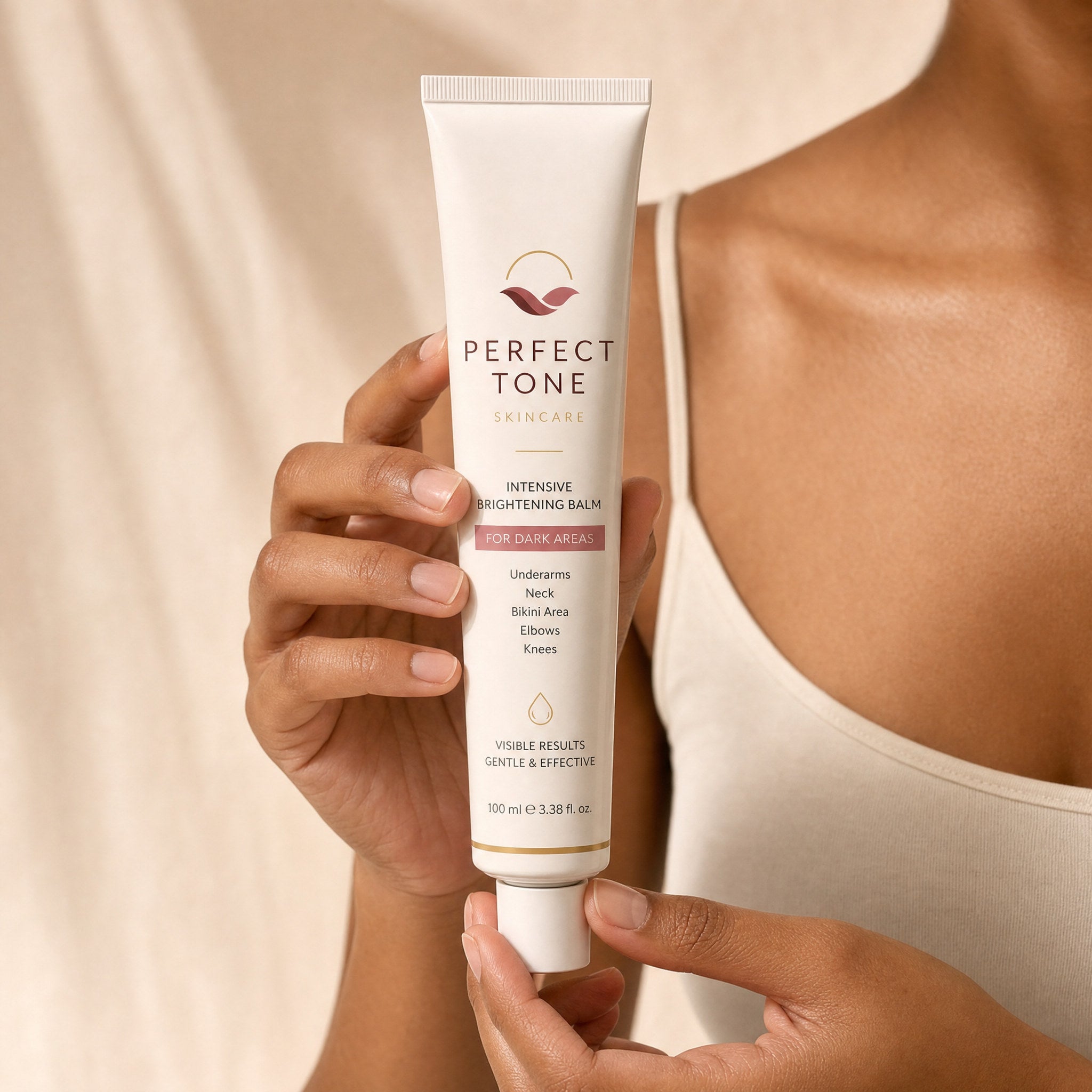 Hands holding the Perfect Tone balm tube